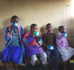 Orphans enjoying an afternoon cup of tea